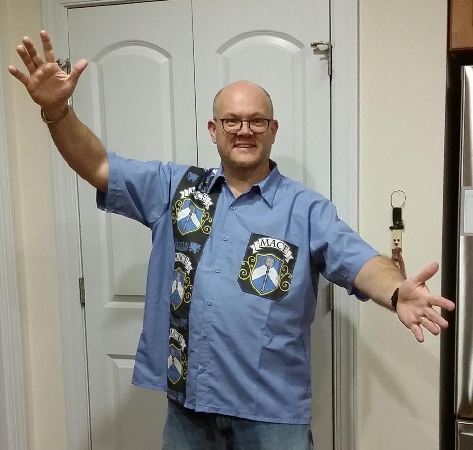 Jeff Smith wearing a Mumswear blue bowling shirt branded to MACE